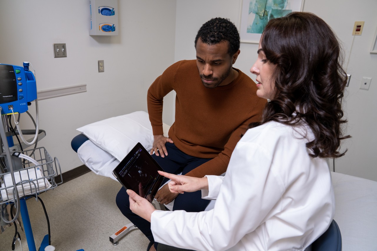 Doctor reviewing x-ray with patient